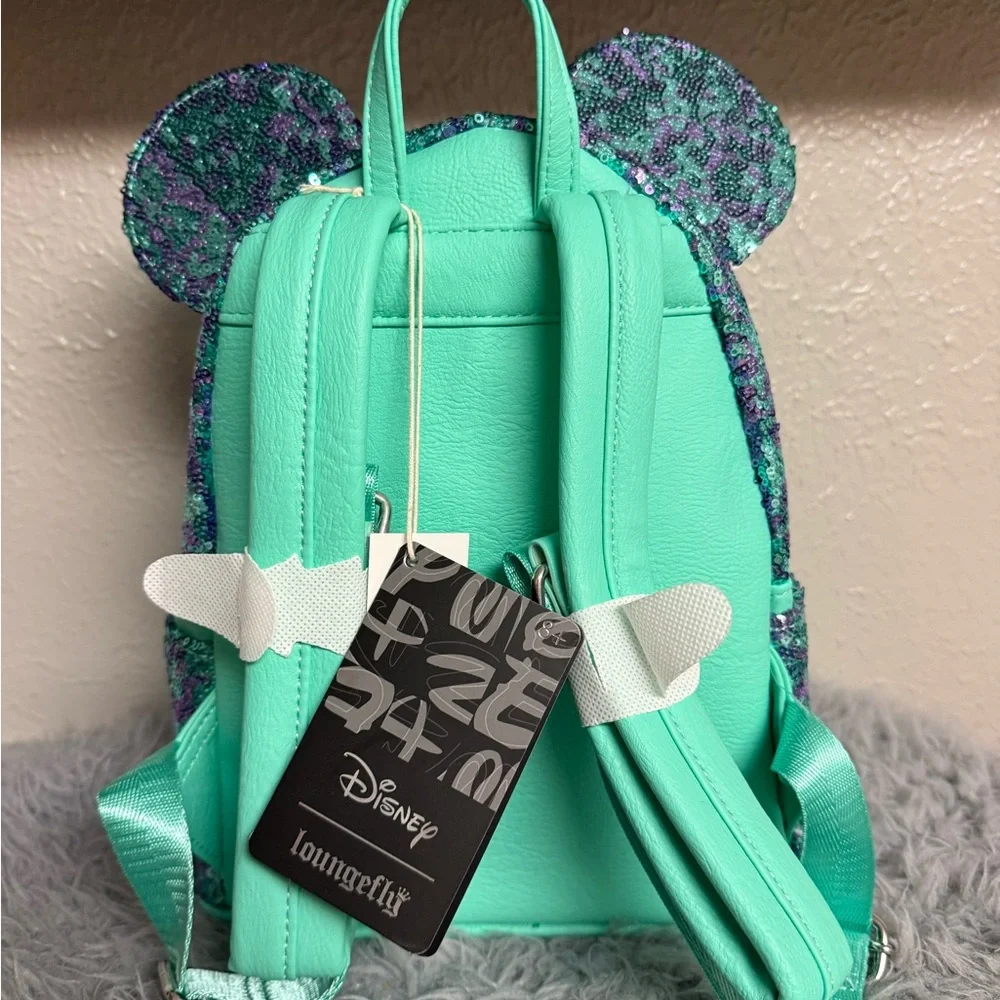 Loungefly Disney Park Mint and Purple Sequin Minnie Ear Backpack with Bow